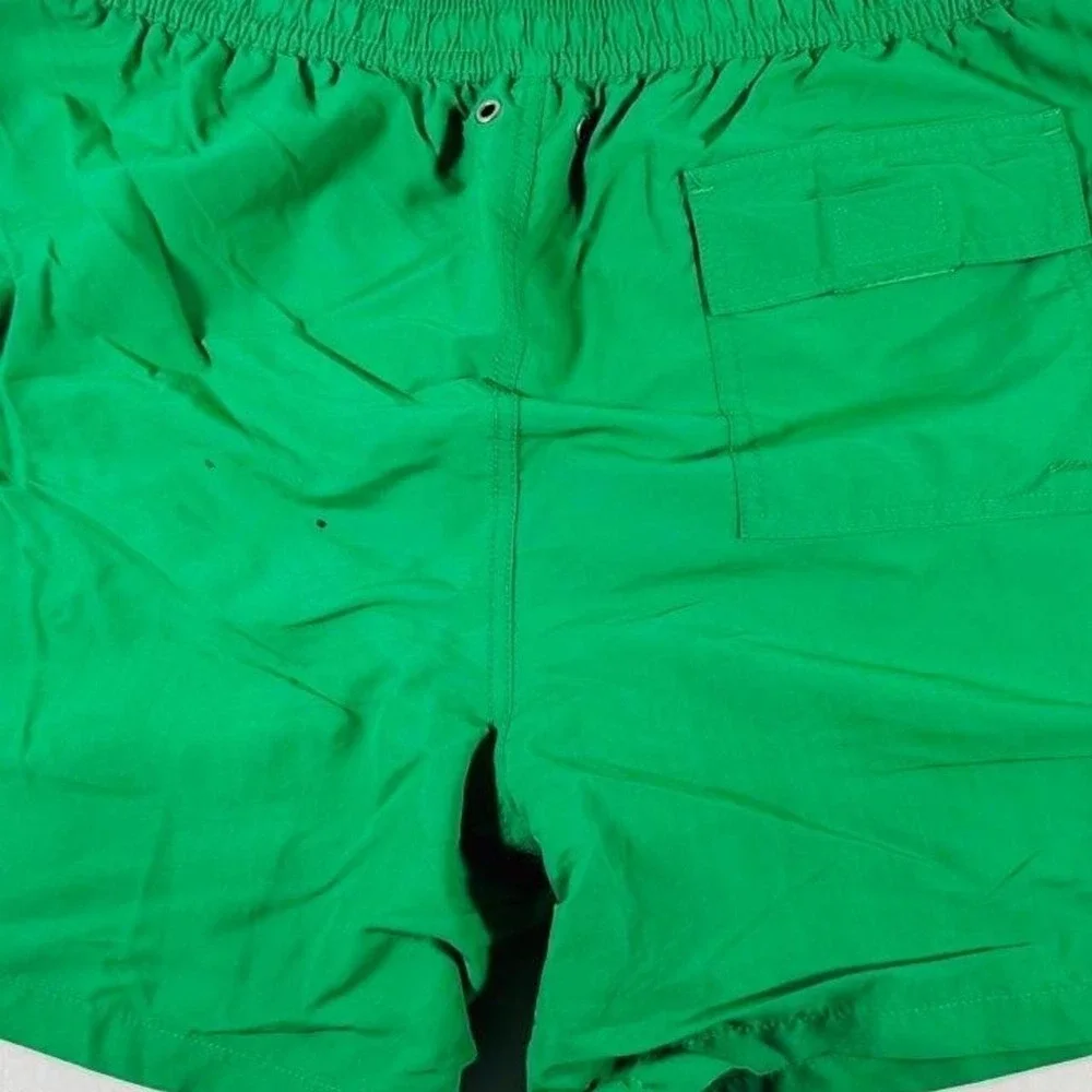 Polo Ralph Lauren green swim trunks with yellow trim.